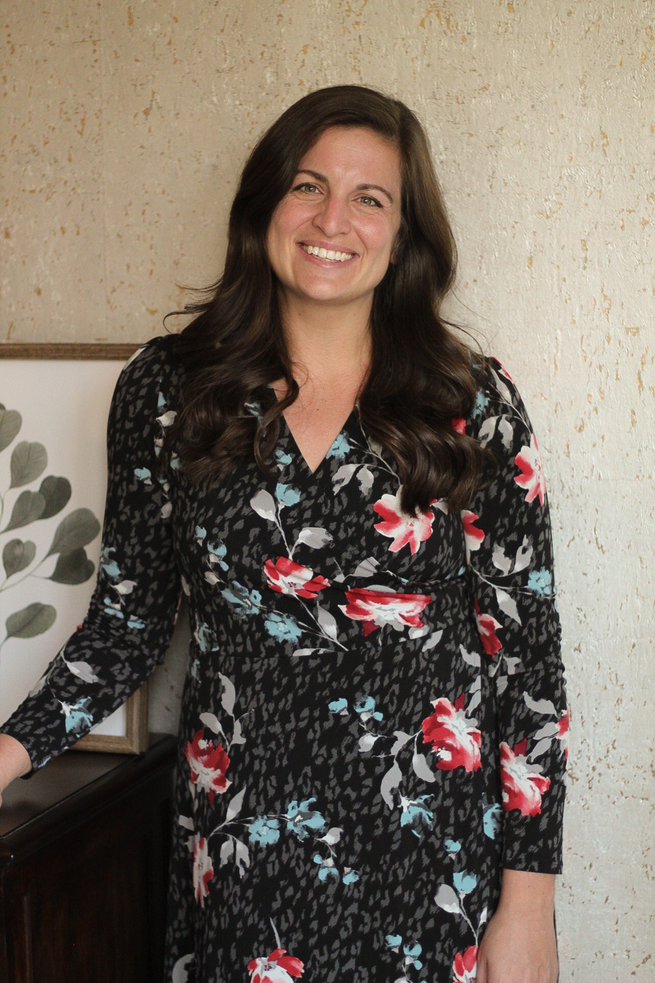 Dr. Laurie Kincade, a neuroaffirming psychologist in Minnesota, smiling warmly in a professional setting