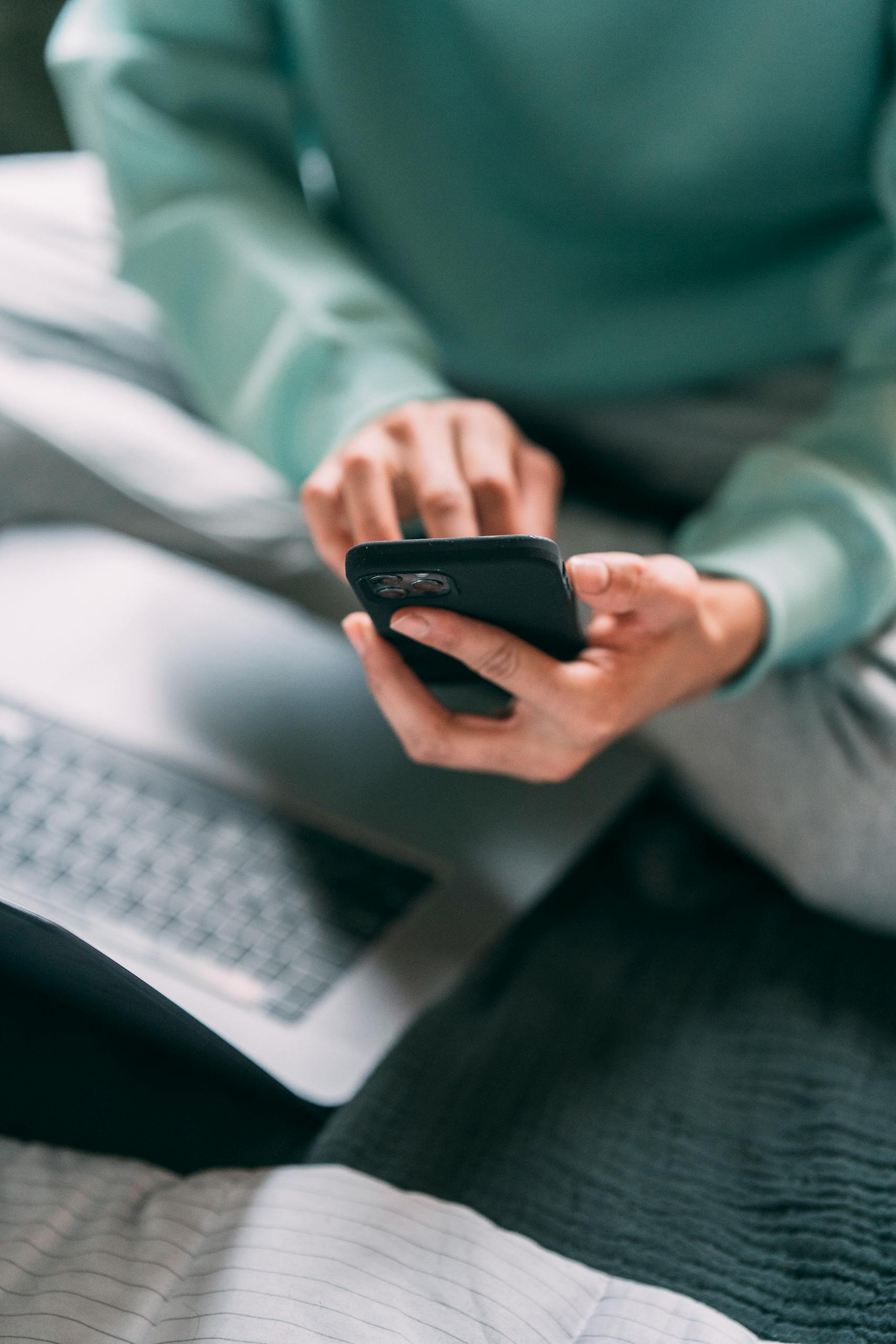 Person using a smartphone to contact Neuro Allies for psychological evaluations in Minnesota.